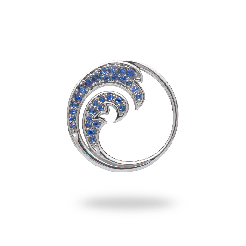 white gold wave pendant with blue sapphires